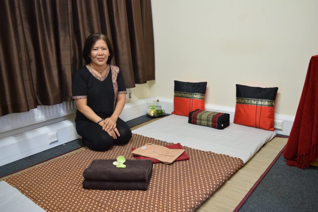 Sisadee at the traditional Thai massage mat in her Egham studio